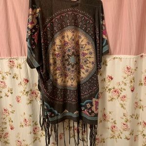 Beautiful kimono goes great over a colorful top.